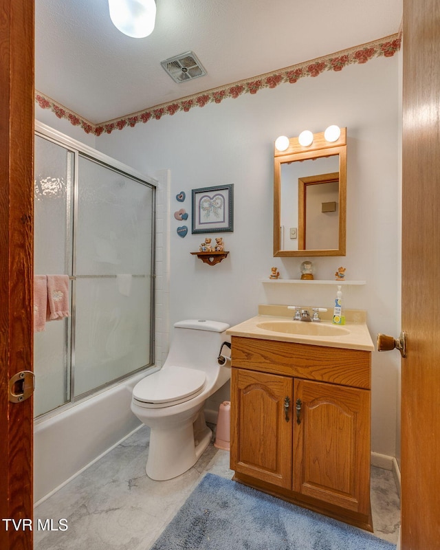 253 Fairford Ln, Blountville, TN 37617 - bathroom featuring toilet, vanity, and enclosed tub / shower combo