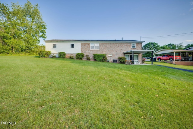 253 Fairford Ln, Blountville, TN 37617 - back of house with a yard and brick siding