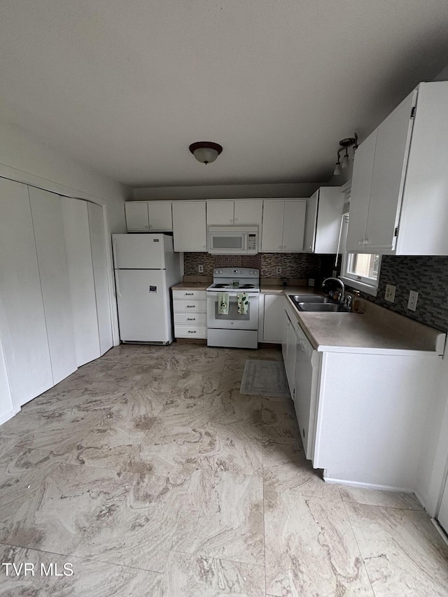 182 Oakcrest Cir Unit 2, Bristol, VA 24201 - kitchen with white appliances, a sink, decorative backsplash, and white cabinets