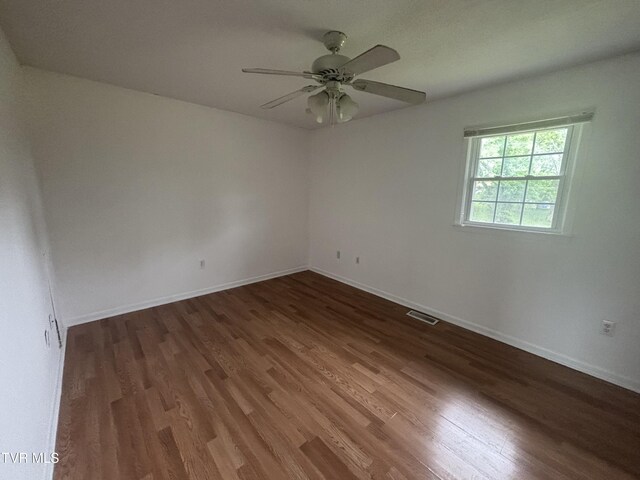 182 Oakcrest Cir Unit 2, Bristol, VA 24201 - spare room featuring wood finished floors, a ceiling fan, and baseboards
