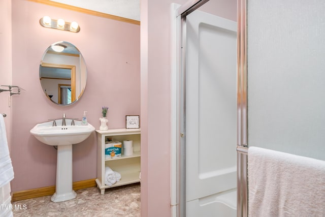 198 Gunbarrel Ln, Butler, TN 37640 - bathroom with a sink, a shower, and baseboards