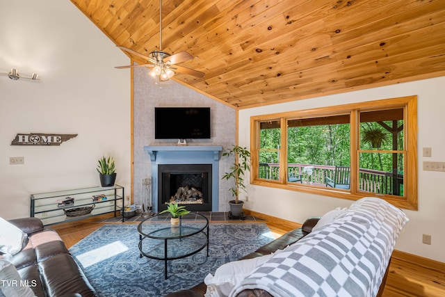 198 Gunbarrel Ln, Butler, TN 37640 - living area with lofted ceiling, wooden ceiling, a fireplace, a ceiling fan, and wood finished floors
