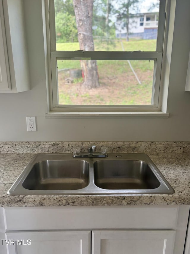 161 Jack Rival Way, Dungannon, VA 24245 - kitchen view of a sink, light countertops, and white cabinets