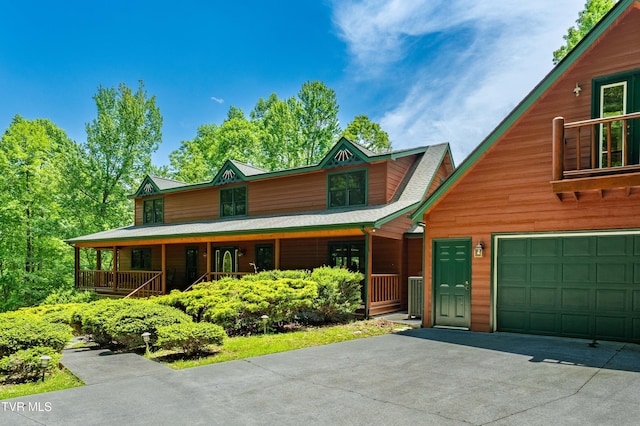 203 Bear Ridge Dr, Butler, TN 37640 - chalet / cabin featuring asphalt driveway, a porch, and a garage