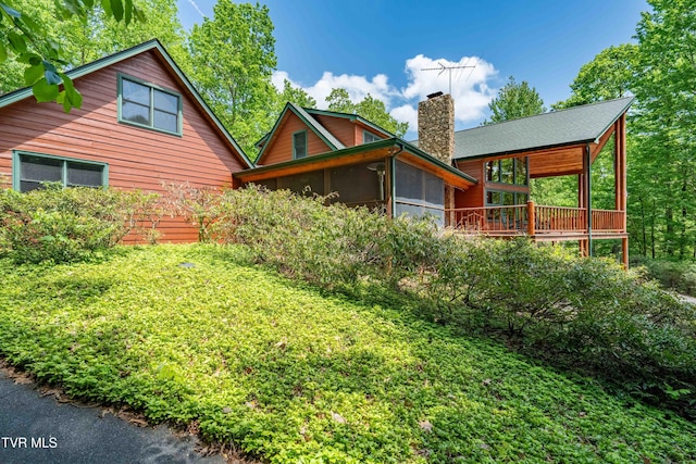 203 Bear Ridge Dr, Butler, TN 37640 - rear view of house featuring a chimney and a sunroom