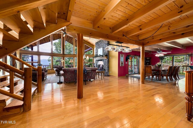 203 Bear Ridge Dr, Butler, TN 37640 - living room with ceiling fan, plenty of natural light, light wood-style floors, wood ceiling with exposed beams, and a fireplace