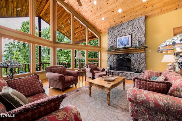 203 Bear Ridge Dr, Butler, TN 37640 - living area featuring wood ceiling, wood finished floors, healthy amount of natural light, high vaulted ceiling, and a stone fireplace