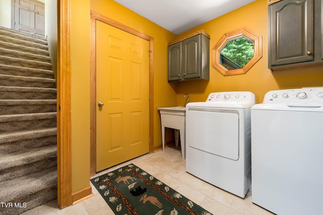 203 Bear Ridge Dr, Butler, TN 37640 - laundry room featuring cabinet space, washer and dryer, and light tile patterned flooring