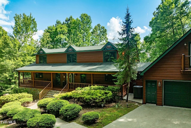 203 Bear Ridge Dr, Butler, TN 37640 - rustic home with covered porch, central air condition unit, a garage, and stairs