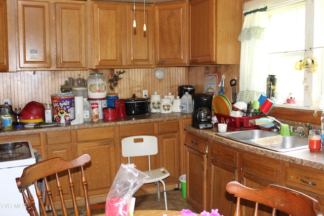 2967 Left Poor Valley Rd, Pennington Gap, VA 24277 - kitchen featuring a sink, electric range, and brown cabinetry