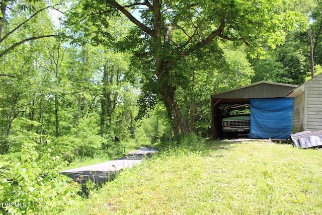 2967 Left Poor Valley Rd, Pennington Gap, VA 24277 - view of yard with a carport and a wooded view