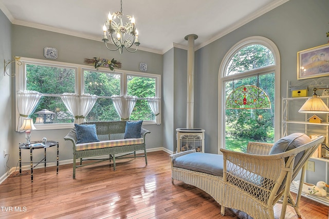 4619 Merrywood Ave, Kingsport, TN 37664 - sitting room featuring plenty of natural light, a wood stove, hardwood / wood-style floors, ornamental molding, and a chandelier