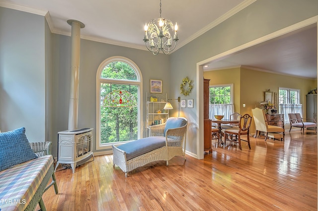 4619 Merrywood Ave, Kingsport, TN 37664 - sitting room with a wood stove, crown molding, light wood-type flooring, plenty of natural light, and a chandelier