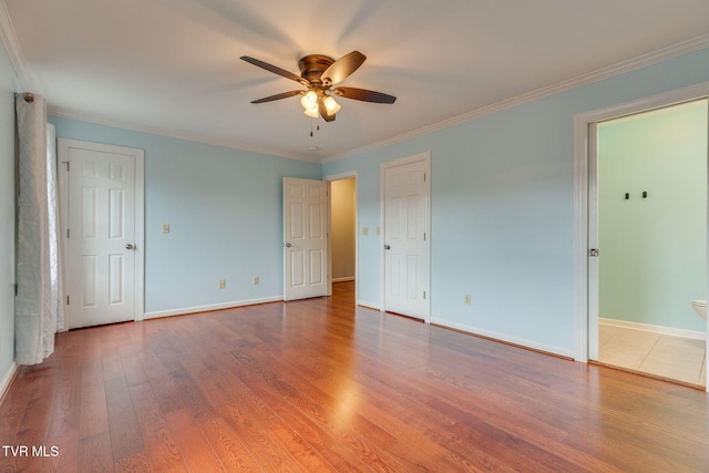1101 E 8th Ave Unit 5, Johnson City, TN 37601 - unfurnished bedroom with wood finished floors, ornamental molding, baseboards, and ceiling fan