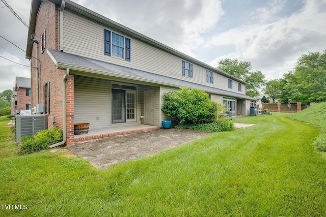 1101 E 8th Ave Unit 5, Johnson City, TN 37601 - rear view of property with cooling unit, a lawn, and brick siding