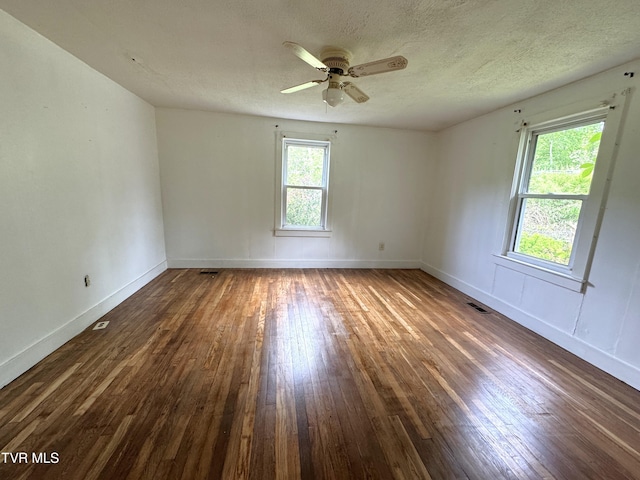 142 Sheryl Turner Rd, Big Stone Gap, VA 24219 - empty room featuring hardwood / wood-style floors, ceiling fan, baseboards, and a textured ceiling