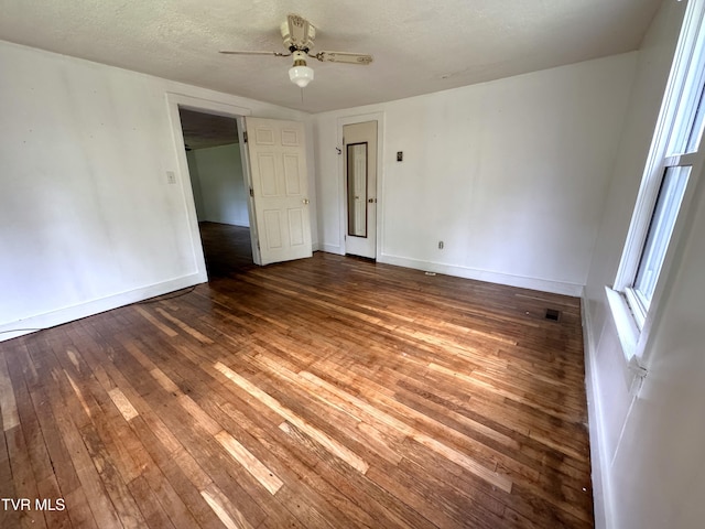 142 Sheryl Turner Rd, Big Stone Gap, VA 24219 - unfurnished bedroom featuring hardwood / wood-style flooring, baseboards, and ceiling fan