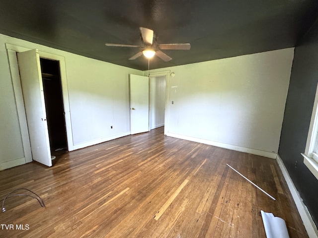 142 Sheryl Turner Rd, Big Stone Gap, VA 24219 - unfurnished bedroom featuring wood finished floors, baseboards, and a ceiling fan