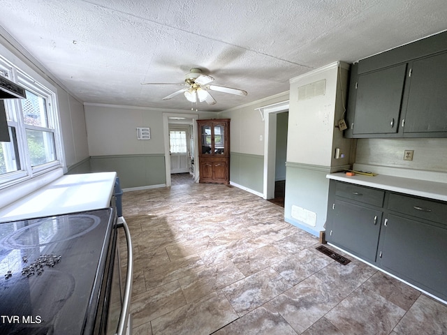142 Sheryl Turner Rd, Big Stone Gap, VA 24219 - kitchen featuring healthy amount of natural light, a ceiling fan, electric range oven, a textured ceiling, and light countertops