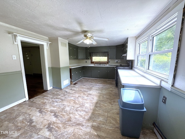 142 Sheryl Turner Rd, Big Stone Gap, VA 24219 - kitchen with a sink, range, a textured ceiling, a ceiling fan, and baseboards