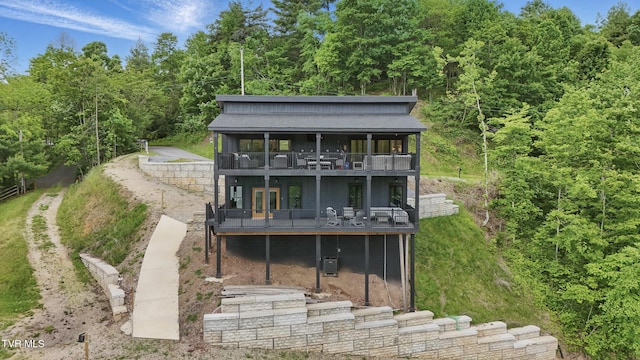 273 Campbell Rd, Butler, TN 37640 - back of house featuring a deck, a forest view, and a shingled roof