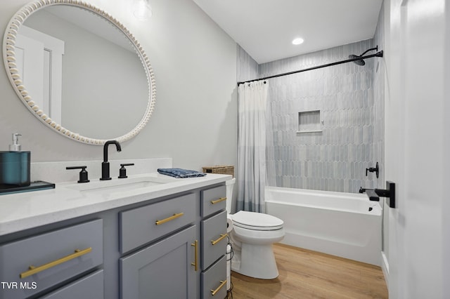 273 Campbell Rd, Butler, TN 37640 - bathroom featuring vanity, shower / bath combo with shower curtain, toilet, wood finished floors, and recessed lighting