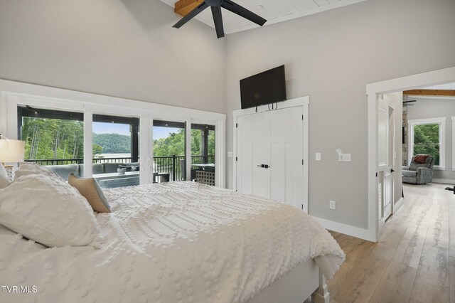 273 Campbell Rd, Butler, TN 37640 - bedroom with access to outside, a high ceiling, light wood-style floors, baseboards, and a ceiling fan