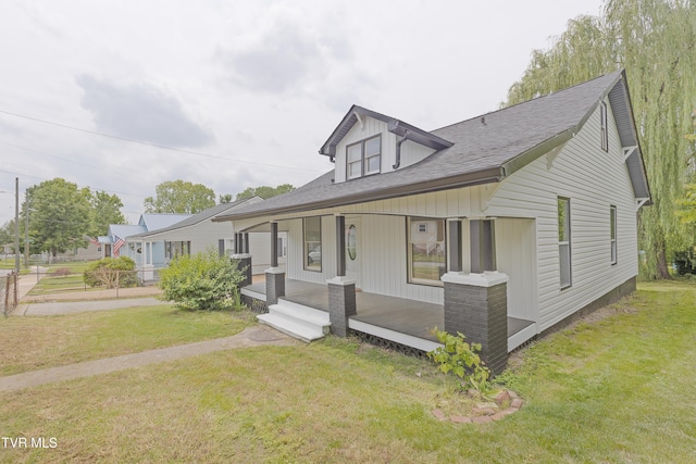 329 Clinch St, Kingsport, TN 37660 - view of front facade featuring covered porch, a front lawn, and a shingled roof