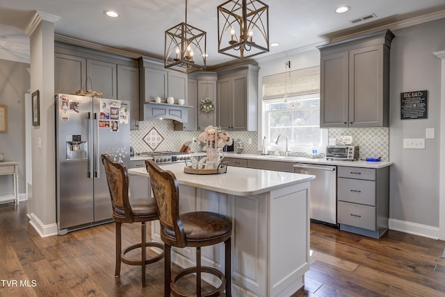 1 Celebration Ct, Johnson City, TN 37601 - kitchen featuring stainless steel appliances, gray cabinets, crown molding, recessed lighting, and backsplash