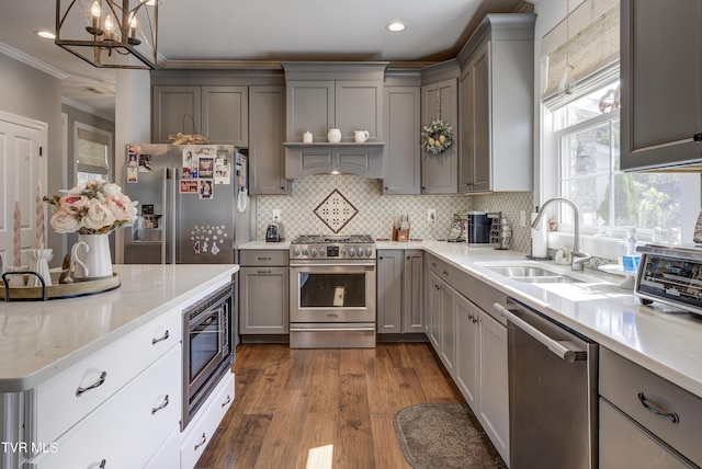 1 Celebration Ct, Johnson City, TN 37601 - kitchen with high end appliances, a sink, gray cabinetry, crown molding, and dark wood-style floors