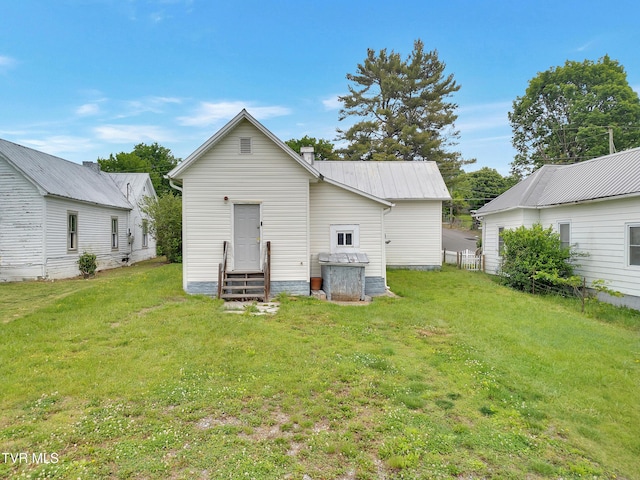 382 Texas Ave, Bristol, VA 24201 - back of property featuring entry steps, a lawn, metal roof, and a chimney