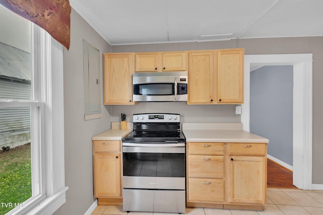 382 Texas Ave, Bristol, VA 24201 - kitchen with stainless steel appliances, light brown cabinets, light tile patterned floors, and baseboards