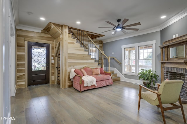 403 Catawba St, Erwin, TN 37650 - entrance foyer with stairway, ornamental molding, a fireplace, ceiling fan, and wood finished floors