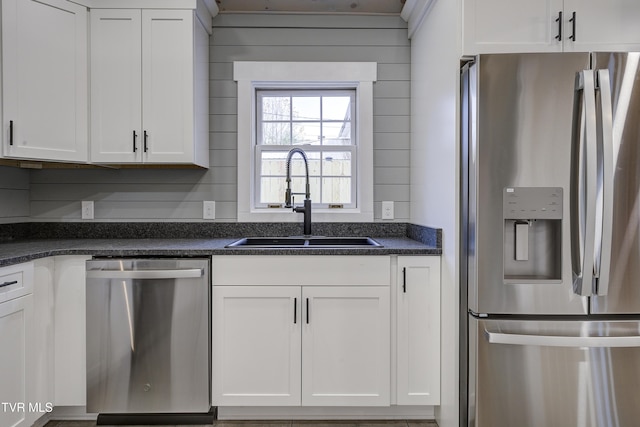 403 Catawba St, Erwin, TN 37650 - kitchen with appliances with stainless steel finishes, a sink, and white cabinetry