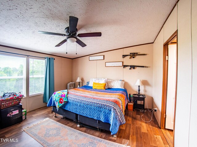 1029 Red Bud Ln, Rogersville, TN 37857 - bedroom with light wood finished floors, crown molding, a textured ceiling, and a ceiling fan