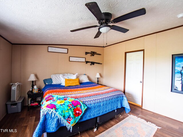1029 Red Bud Ln, Rogersville, TN 37857 - bedroom featuring a textured ceiling, wood finished floors, ornamental molding, and ceiling fan