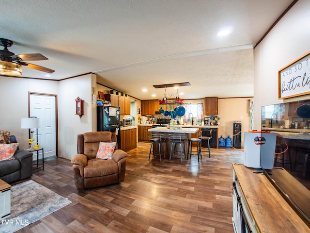 1029 Red Bud Ln, Rogersville, TN 37857 - living area featuring wood finished floors, a ceiling fan, a textured ceiling, crown molding, and recessed lighting
