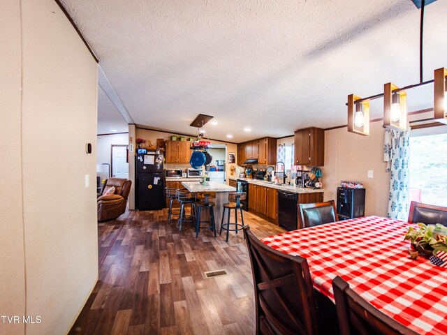 1029 Red Bud Ln, Rogersville, TN 37857 - dining area featuring dark wood-style floors and a textured ceiling