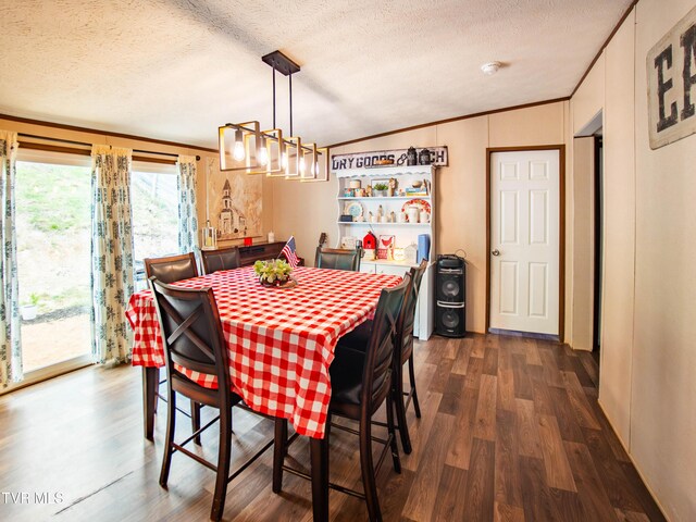 1029 Red Bud Ln, Rogersville, TN 37857 - dining area with dark wood-type flooring, a textured ceiling, crown molding, and a chandelier