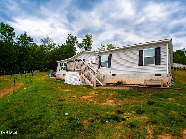 1029 Red Bud Ln, Rogersville, TN 37857 - back of property with crawl space, stairs, a yard, and a wooden deck