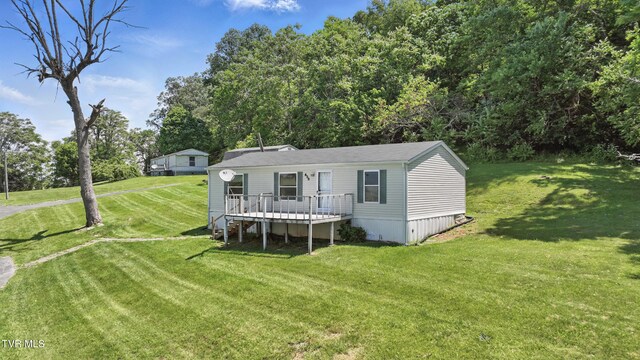 438 Horace Dillow Rd, Limestone, TN 37681 - rear view of house featuring a wooden deck and a lawn