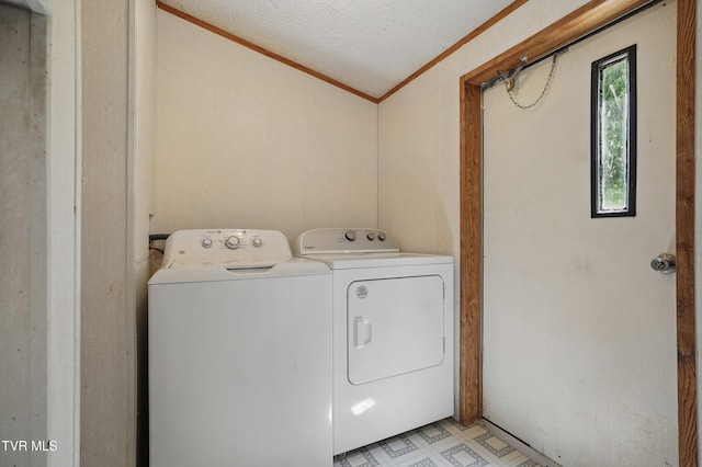 438 Horace Dillow Rd, Limestone, TN 37681 - laundry area featuring crown molding, washing machine and dryer, a textured ceiling, and light flooring