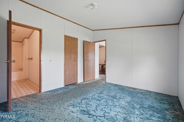 438 Horace Dillow Rd, Limestone, TN 37681 - unfurnished bedroom featuring ornamental molding, carpet floors, ensuite bathroom, and a textured ceiling