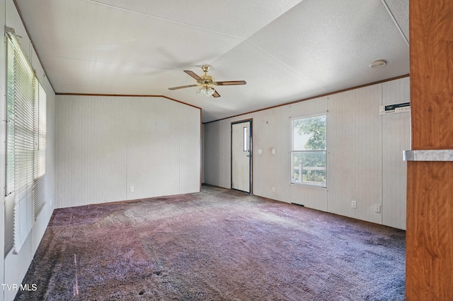 438 Horace Dillow Rd, Limestone, TN 37681 - spare room featuring vaulted ceiling, ceiling fan, carpet flooring, and wood walls