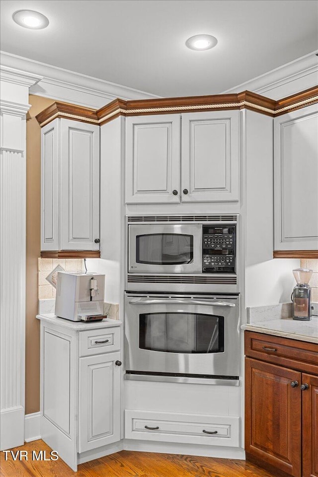 114 Highland Gate Dr, Johnson City, TN 37615 - kitchen with stainless steel appliances, ornamental molding, light countertops, and light wood-style flooring