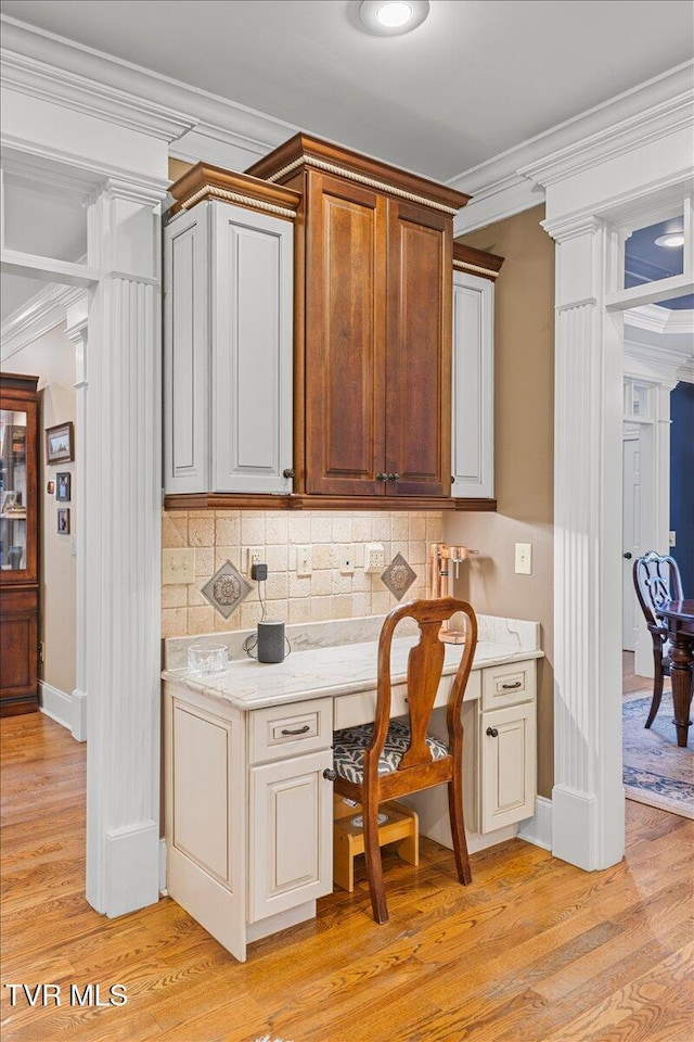 114 Highland Gate Dr, Johnson City, TN 37615 - kitchen featuring ornamental molding, light wood-type flooring, backsplash, baseboards, and decorative columns