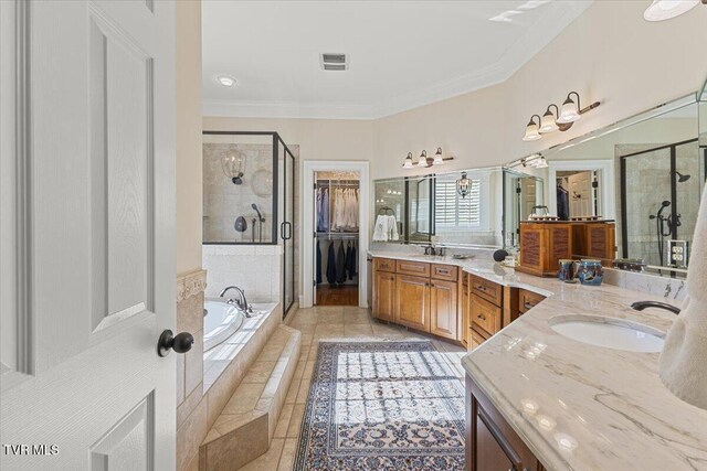 114 Highland Gate Dr, Johnson City, TN 37615 - bathroom with a shower stall, a bath, double vanity, tile patterned flooring, and ornamental molding