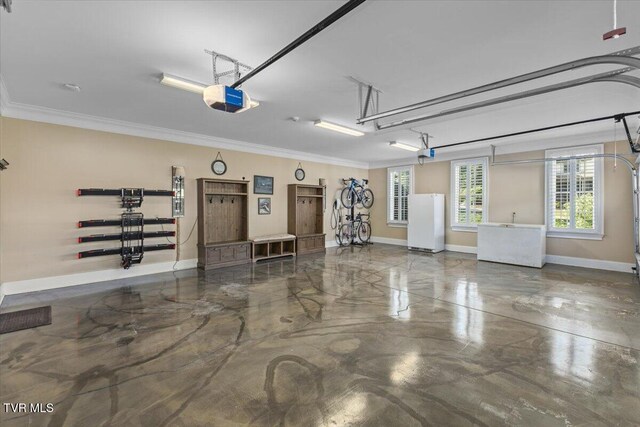 114 Highland Gate Dr, Johnson City, TN 37615 - garage featuring freestanding refrigerator, a garage door opener, and baseboards