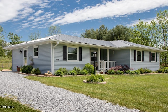 14227 Wellbridge Dr, Meadowview, VA 24361 - ranch-style house featuring metal roof, a front yard, and a porch
