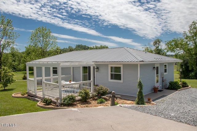14227 Wellbridge Dr, Meadowview, VA 24361 - view of front facade with a front yard and metal roof